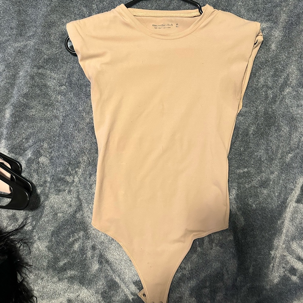 Padded shoulder nude bodysuit